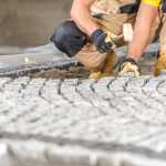 brick driveway being laid by hand
