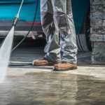 stone driveway being cleaned with jet washer