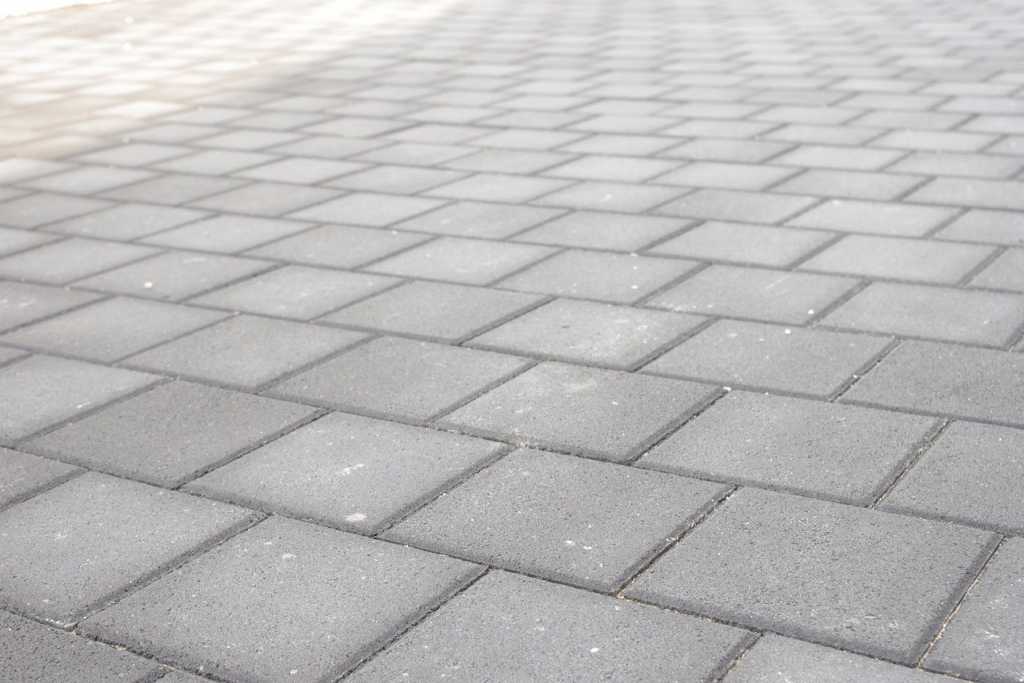 Close up of grey paved footpath